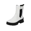 A white Rieker Chelsea boot with a black sole and black elastic side panels, shown against a white background. Náhled obrázku produktu