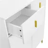 A close-up view of a white cabinet with a drawer pulled out, showing gold handles. Anteprima dell’immagine prodotto
