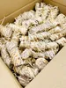 A close-up view of a cardboard box filled with fire starters. Anteprima dell’immagine prodotto