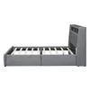 A side view of a grey upholstered bed frame with a slatted mattress support. Náhľad obrázku produktu