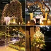A collage of four images showcasing outdoor lighting decorations, including a garden arch, a dining table setup, a swing, and a decorative birdcage, all illuminated by string lights. Náhľad obrázku produktu