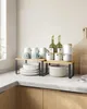 A kitchen counter with a two-tier shelf unit holding various kitchen items. Produktbild-Vorschau