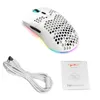 A white gaming mouse with honeycomb design, a white USB cable, and a small instruction booklet are laid out on a white background. Produktbild-Vorschau