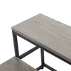 Close-up view of a two-tiered step stool with a gray wood-grain finish and black metal frame. Náhled obrázku produktu