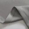 A close-up view of a folded gray fabric, likely a curtain, showing the texture and stitching. Produktbild-Vorschau