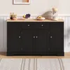 A black sideboard with a wooden top, decorated with fruit and a coffee maker. Produktbild-Vorschau