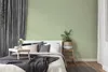 A bedroom setting with a bed, pillows, a tray with a cup and flower, and a plant. Produktbild-Vorschau