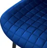 A close-up view of the quilted dark blue velvet seat of a chair. Náhled obrázku produktu
