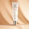 A product shot of a tube of Dr. Irena Eris Face Zone Even Tone Skin Enhancer with SPF 50+ against a softly lit, textured background. Náhled obrázku produktu