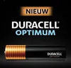 A Duracell Optimum AAA battery is shown against a black background with marketing text. Produktbild-Vorschau