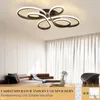 A modern living room with a stylish ceiling lamp, sofa, and curtains. Produktbild-Vorschau