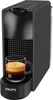 A black Nespresso coffee machine with a cup of espresso on the drip tray. Produktbild-Vorschau