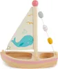A wooden toy sailboat with a whale design on the sail, set against a white background. Anteprima dell’immagine prodotto