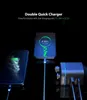 Two smartphones and a charger are shown in a dark setting, with the phones charging. Produktbild-Vorschau