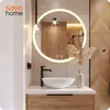 A modern bathroom vanity with a round LED mirror, a vessel sink, and a black faucet. Náhled obrázku produktu