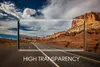 A smartphone screen displaying a scenic road through a canyon, superimposed on a blurred background of the same scenery. Náhľad obrázku produktu