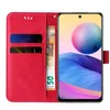 A red flip phone case with card slots and a euro banknote is shown next to a smartphone displaying a colorful wallpaper. Produktbild-Vorschau