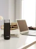 A black Contigo travel mug sits on a desk next to a laptop and notebooks. Anteprima dell’immagine prodotto