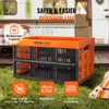 A collapsible storage box is shown outdoors in front of a camper trailer, with musical instruments nearby. Náhled obrázku produktu