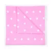 A folded pink baby crib sheet with white stars, laid flat on a white background. Produktbild-Vorschau