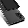 A close-up, angled view of a black flip case for a smartphone, showing the camera module on the back of the phone. Produktbild-Vorschau