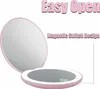 A pink LED compact mirror is shown open, with text highlighting its features. Produktbild-Vorschau