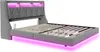 A gray upholstered bed frame with integrated LED lighting. Produktbild-Vorschau