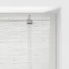 A close-up view of the top mechanism and fabric of a white bamboo roller blind. Náhled obrázku produktu