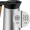 Close-up of a stainless steel thermos with a black lid and a wooden handle, with a circular graphic overlay showing snowflake and wavy line icons with time durations. Voir les images du produit