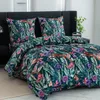 A bed with a duvet and pillows featuring a floral and monkey pattern. Produktbild-Vorschau