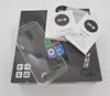 The image shows the box and accessories for a smartphone, including a clear case and instruction manuals. Voir les images du produit
