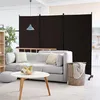 A living room scene with a sofa, coffee table, and a room divider. Náhled obrázku produktu