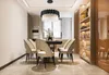A dining room with a chandelier, dining table, chairs, and a bookshelf. Produktbild-Vorschau