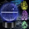 A collage of Star Wars-themed 3D LED lamps in various colors, including the Death Star, Millennium Falcon, R2-D2, and BB-8, set against a dark, cloudy background with planets and spaceships. Produktbild-Vorschau