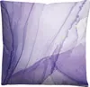 A close-up view of a pillow with a violet watercolor-like design. Produktbild-Vorschau