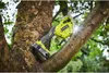 A Ryobi pruning saw is attached to a tree branch, ready to cut. Podgląd zdjęcia produktu