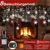 Christmas lights and stockings hanging over a fireplace. Anteprima dell’immagine prodotto