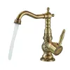 A single antique-style faucet with water flowing from the spout, isolated on a white background. Podgląd zdjęcia produktu