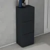 A dark gray shoe cabinet with three drawers stands against a light gray wall. Produktbild-Vorschau