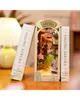 A 3D wooden model of a scene with cherry blossoms, flanked by two book-like structures. Náhled obrázku produktu
