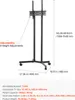 A black rolling TV stand with dimensions and adjustability information displayed. Produktbild-Vorschau