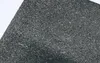 A close-up view of a textured, dark gray surface, possibly a material or a part of a larger object. Produktbild-Vorschau