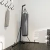 A boxing bag and stand in a gym setting. Produktbild-Vorschau
