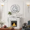 A living room scene featuring a large wall clock above a fireplace. Anteprima dell’immagine prodotto