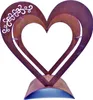 A metal heart-shaped sculpture with a decorative flourish on one side, set against a white background. Produktbild-Vorschau