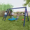 Three children are playing on a blue swing set with a ladder and a mat swing in a grassy backyard.