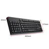 A black keyboard is shown from a slightly elevated side angle against a white background, with dimensions indicated by red lines and text. Náhled obrázku produktu