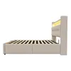 Side view of a beige upholstered bed frame with a slatted mattress support and integrated LED lighting in the headboard. Náhľad obrázku produktu