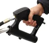 A hand holding a black high-pressure washer spray gun. Produktbild-Vorschau