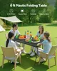 A family is enjoying a meal outdoors at a picnic table. Produktbild-Vorschau